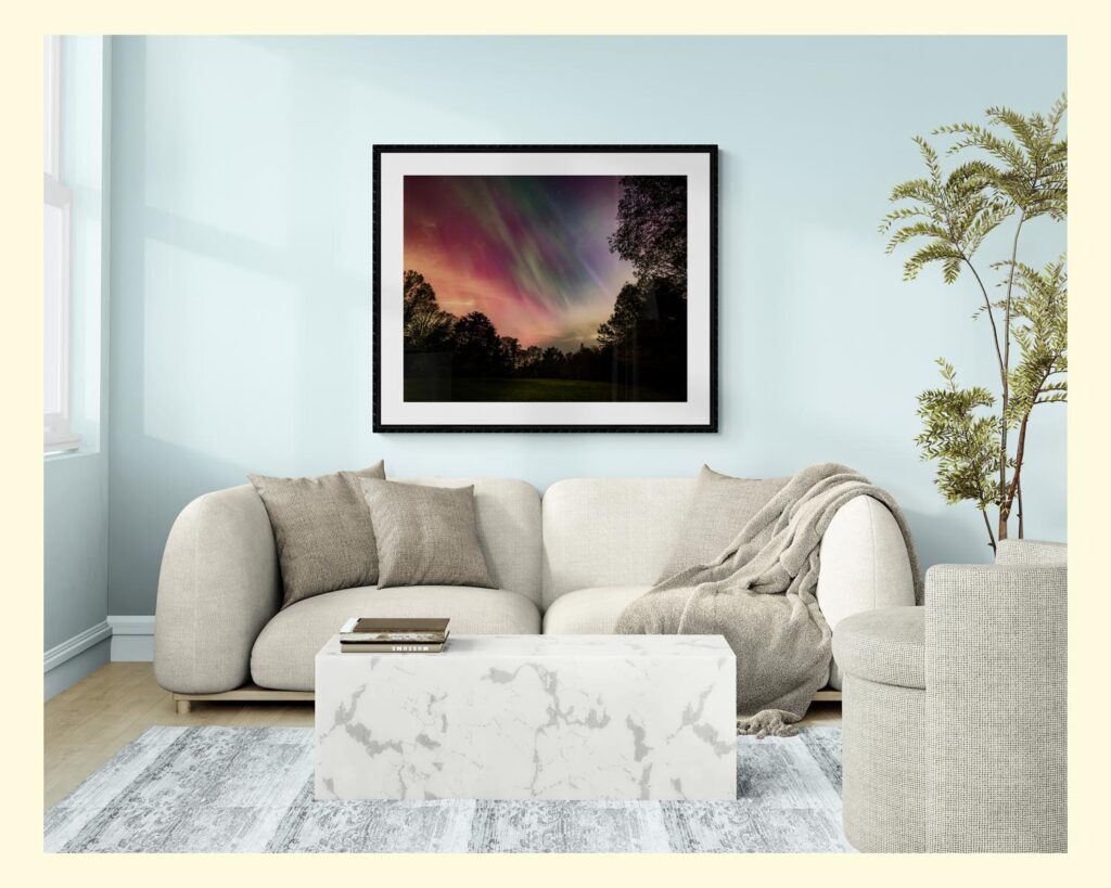 Seana Dowling Photography A living room with beautiful wall art of the Northern Lights on a light aqua wall